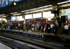 People waiting on one of the Yokohama station platform