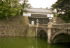 Another gate of the Imperial Palace in Tokyo, over a bridge and with two guards.